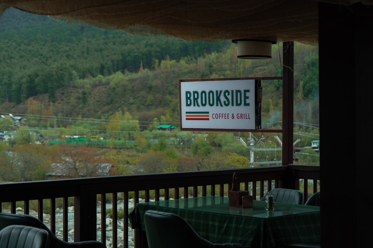 Freshly brewed specialty coffee and gourmet sweet treats served at Brookside Cafe, Pahalgam