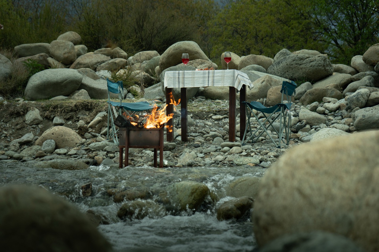 Beautiful view of the Lidder River winding through Pahalgam valley near Walnut Village Resort