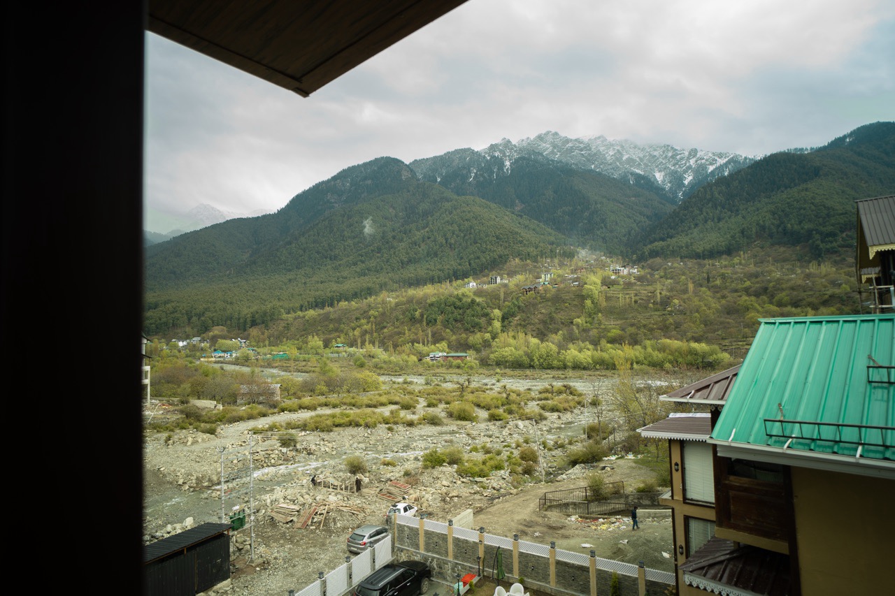Spectacular view of pine forests and Himalayan mountain peaks from the Riverview Premium balcony